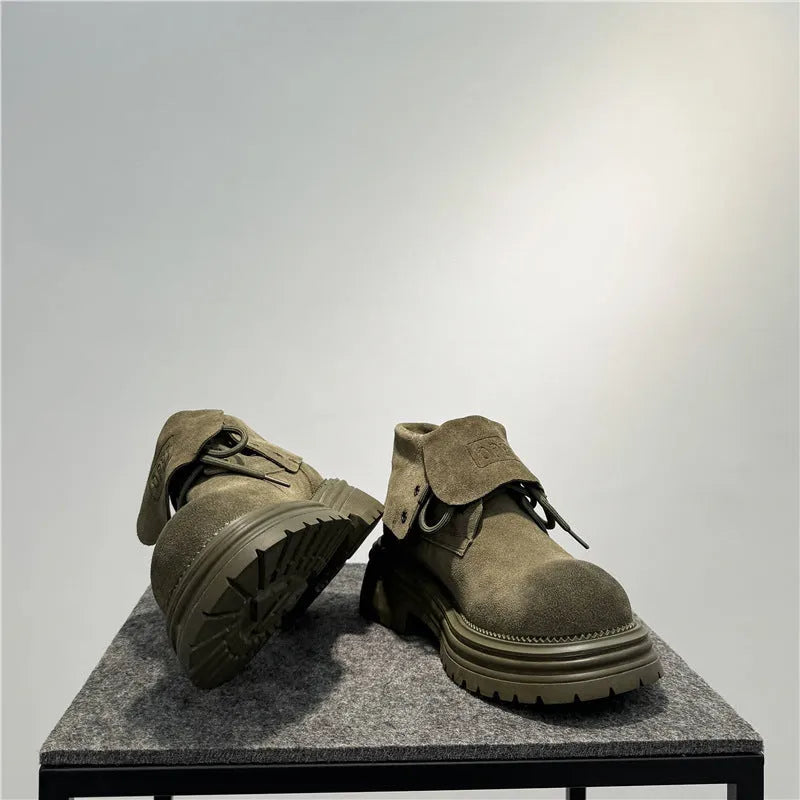Retro distressed worker style boots in cow suede with thick soles and visible sewing lines