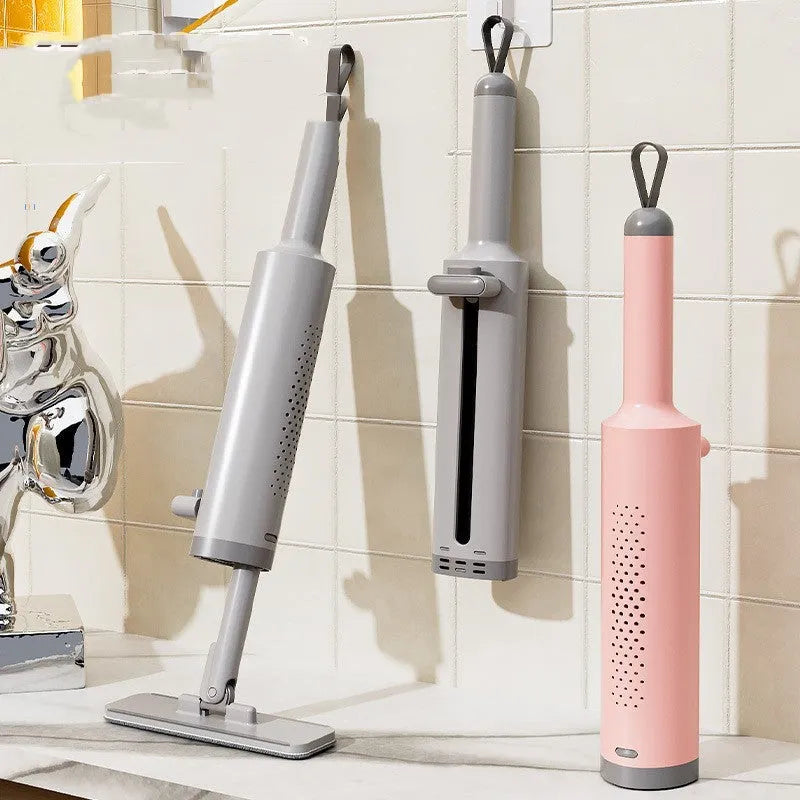 Rotatable self-squeeze flat mop with microfiber pads in grey, pink, or white.