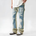 Yellow and blue retro patchwork jeans with splash-ink damaged design details on denim fabric