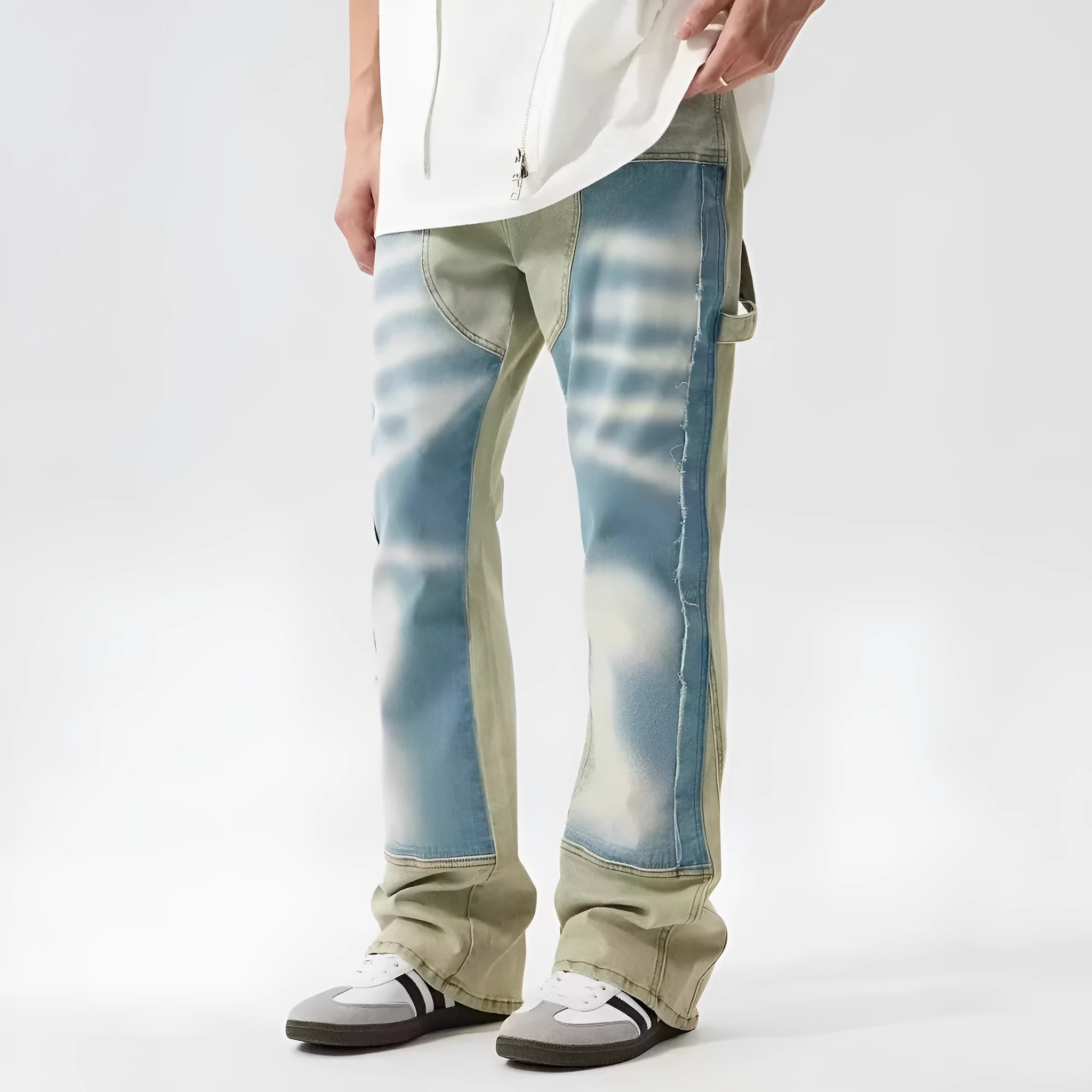 Yellow and blue retro patchwork jeans with splash-ink damaged design details on denim fabric