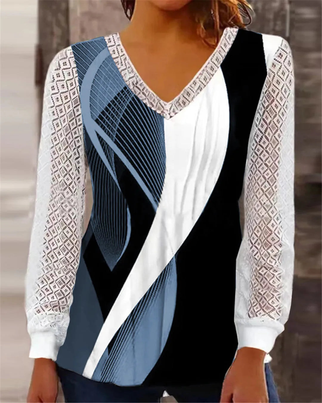 Women's loose purple V-neck top with hollow-out lace print detail and long sleeves.