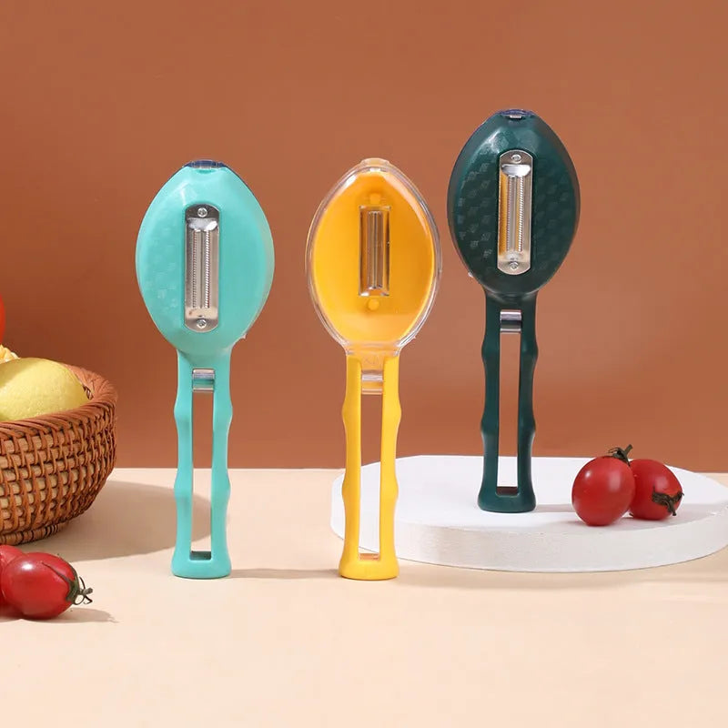 Yellow peeling knife with a blade cover, next to a potato on a kitchen counter