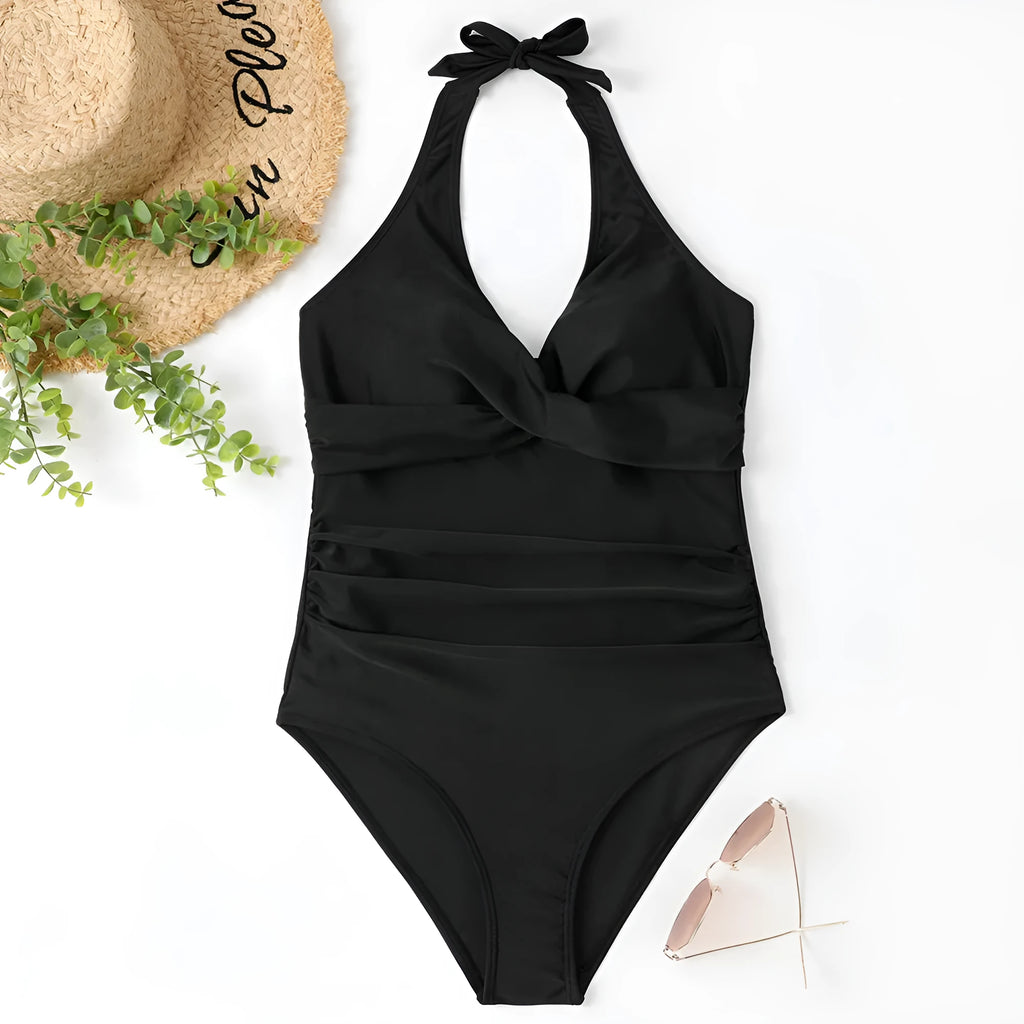 Women's solid colour one-piece swimsuit in bikini style on a mannequin.