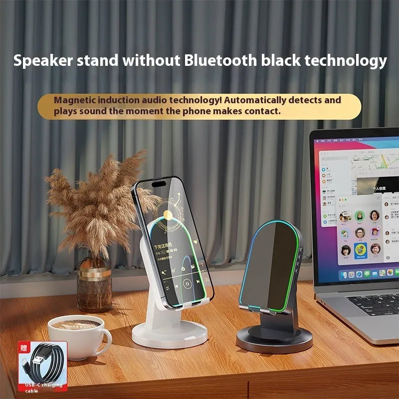 Three-in-one wireless induction speaker and Bluetooth phone bracket in black or white, with built-in battery and USB cable