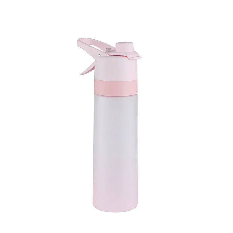 Large pink plastic spray water bottle with a handle strap and leakproof lid on a gym bag.