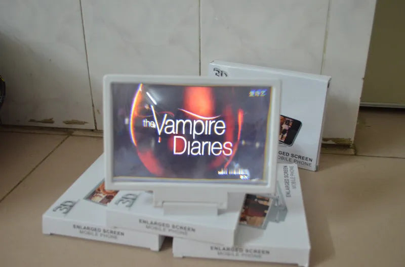 Black and white portable screen magnifier for tablets and smartphones, shown with protective film.
