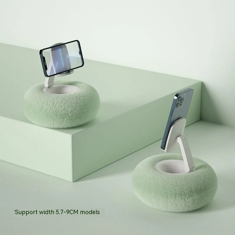 Adjustable rotating bracket holding a tablet on a desk, showing vertical lift and clamp mechanism.