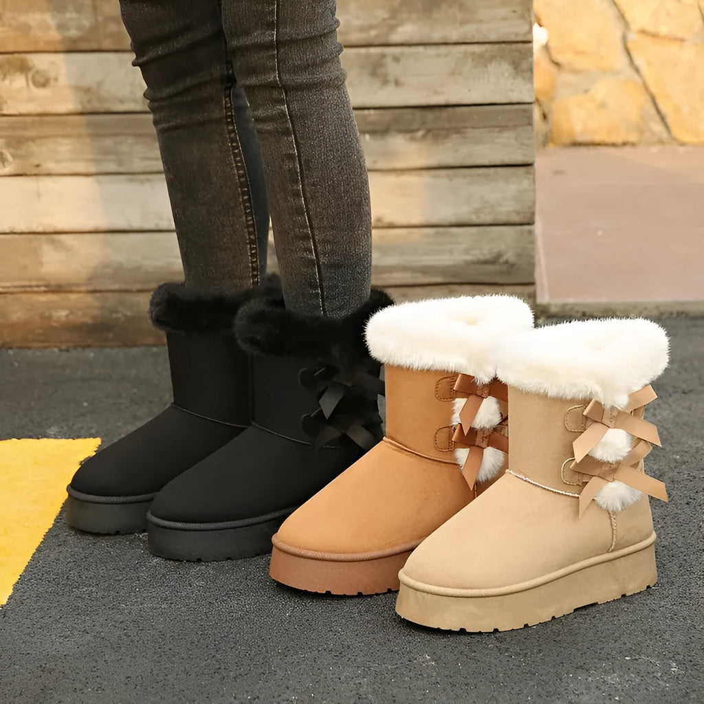 Women's black suede fleece lined ankle boots with bow, side view showing high-top shaft