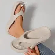 Women's black thick-soled EVA flip-flops with non-slip tread in a paired size format