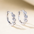 Pair of C-shaped 925 silver earrings with diamond treatment, available in yellow or white, geometric round and oval design