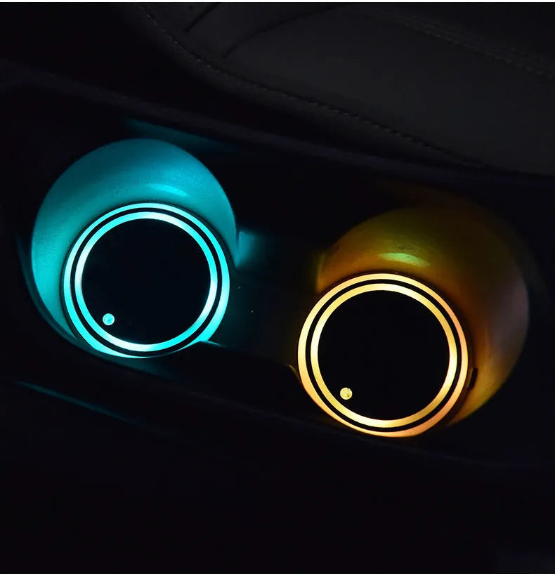 Colourful LED light-up coaster for car cup holder with USB cable, showing multiple light colours.