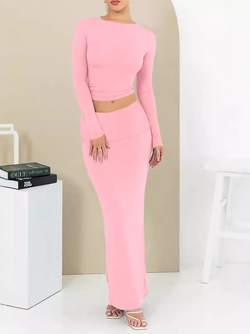 Women's black sweet style two-piece suit with three-quarter sleeve top and long skirt.