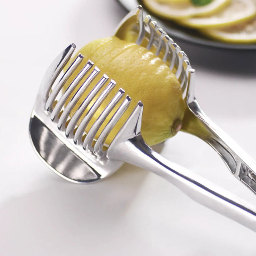 Silver plastic lemon slicer kitchen gadget on a countertop