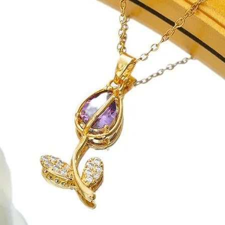 Gold tone zircon tulip pendant necklace on a model, showing the adjustable O-ring chain.