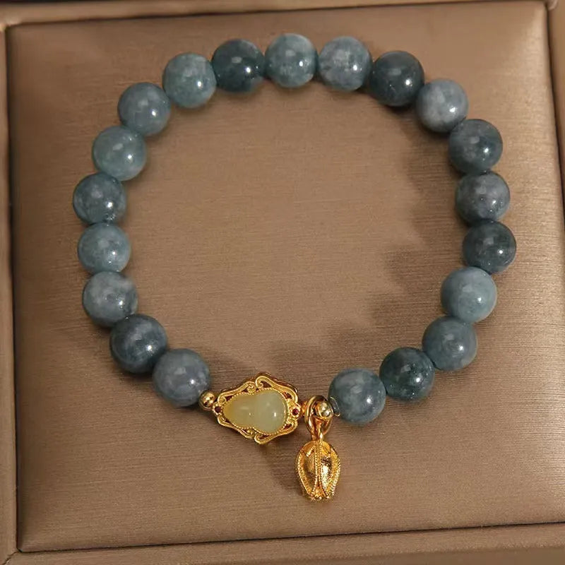 Sky blue natural stone gourd and lotus pendant bracelet for women with electroplated finish.