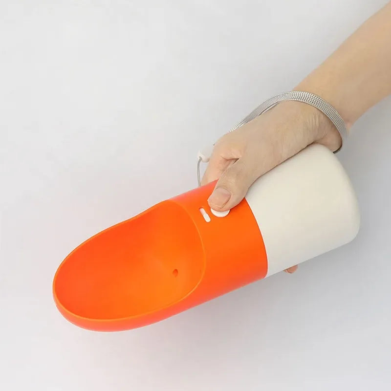MOESTAR white and grey rocket-shaped pet drinking cup with a black drinking nozzle and lock button.