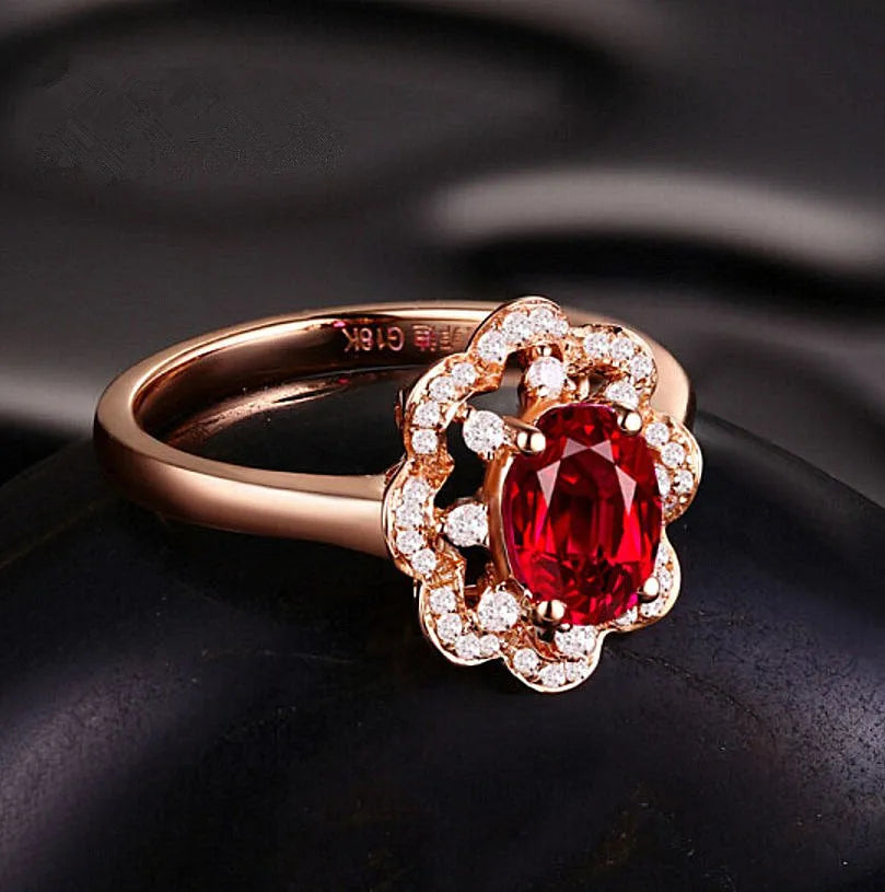 Silver rose gold adjustable ring with synthetic ruby stone on white background