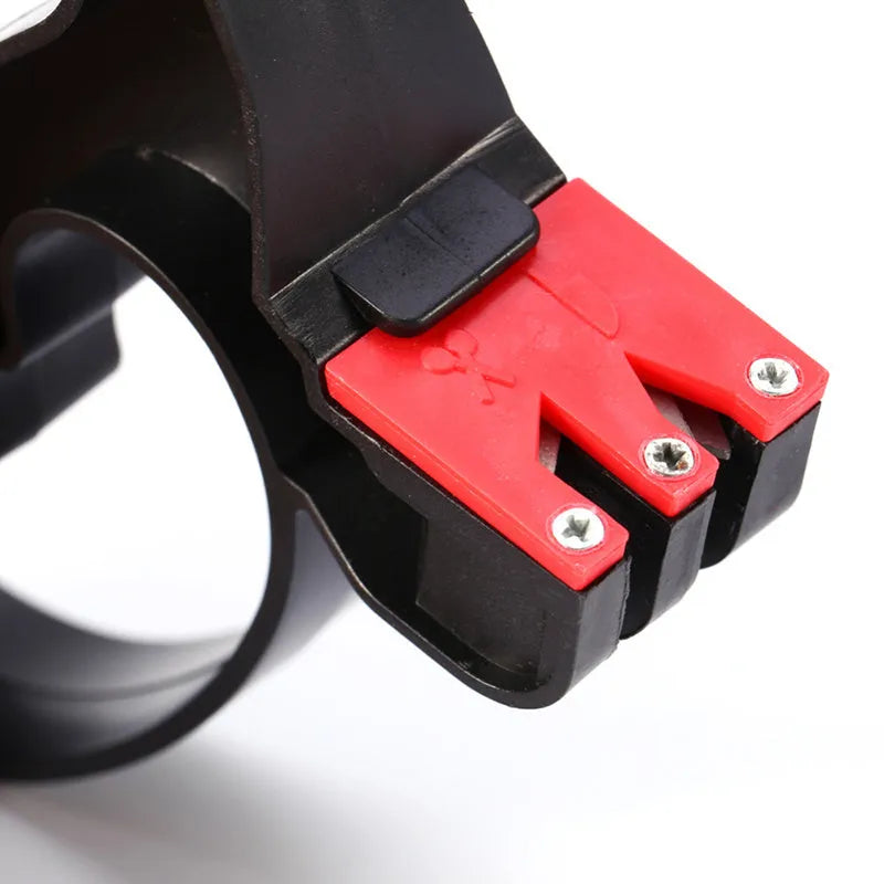 Black handheld knife and scissor sharpener with ergonomic grip on white background