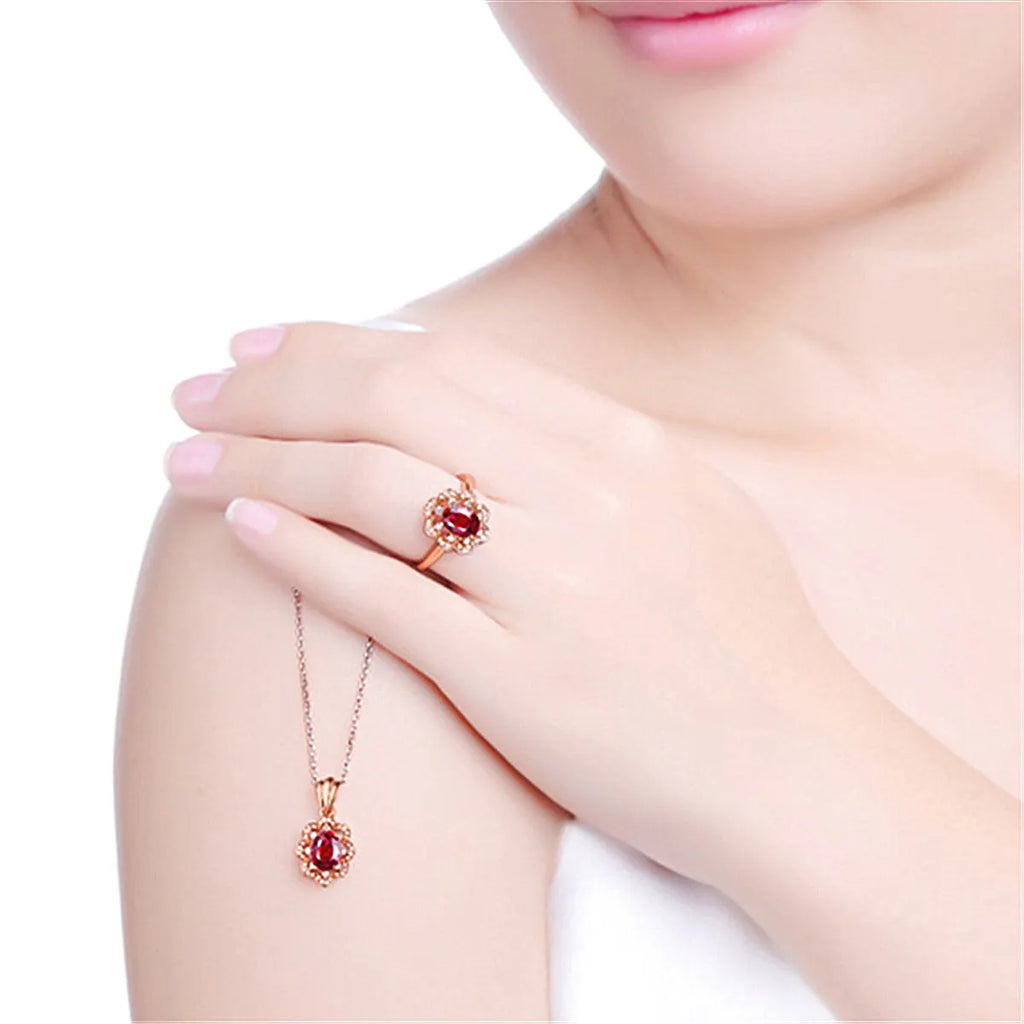 Silver rose gold adjustable ring with synthetic ruby stone on white background