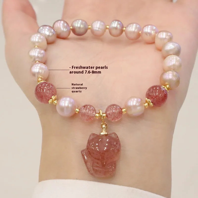 Light pink women's freshwater pearl bracelet with strawberry quartz stones and fox charm