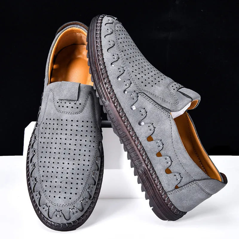 Men's brown slip-on casual shoes made of PU leather with a flat sole and round toe cap.