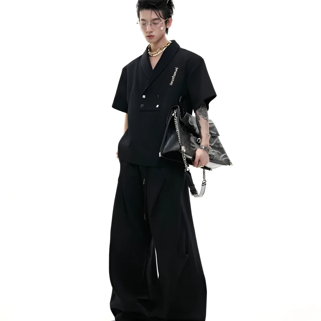 Men's dark grey metal embellished sports suit with V-neck jacket and shorts on a hanger