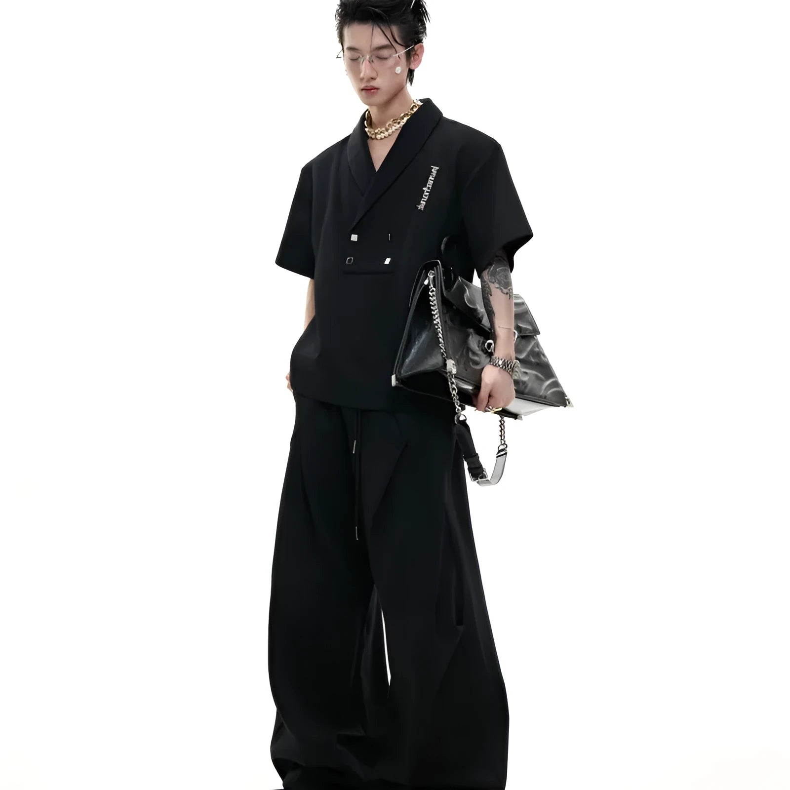Men's dark grey metal embellished sports suit with V-neck jacket and shorts on a hanger