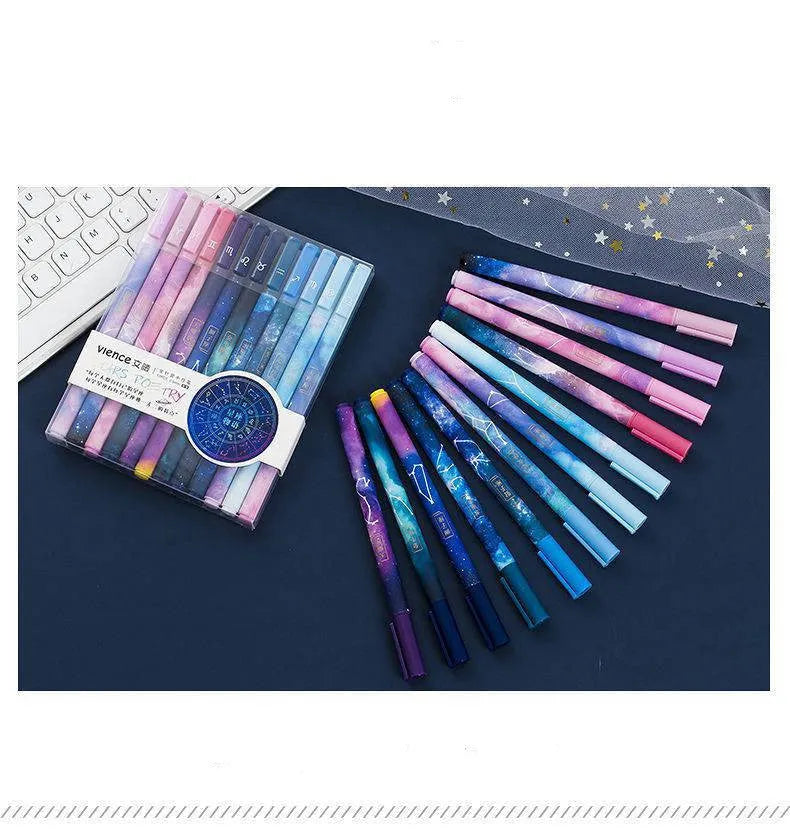 Twelve zodiac constellation ballpoint pens in assorted colours with plastic barrels and star motifs