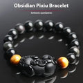 Black obsidian bracelet with gold sheen finish and Pixiu charm in four size options