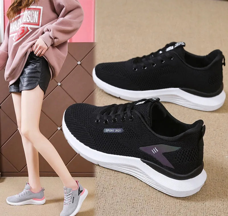 Women's low top casual running shoes in beige with mesh upper, lace-up front, round toe, and soft PVC sole