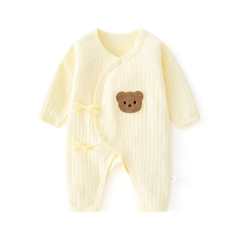 White cotton newborn jumpsuit with top fly lace closure and jacquard teddy bear straps