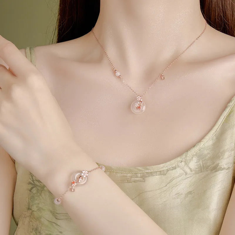 S925 sterling silver women's bracelet with white chalcedony crystal and Koi-themed new Chinese floral design.