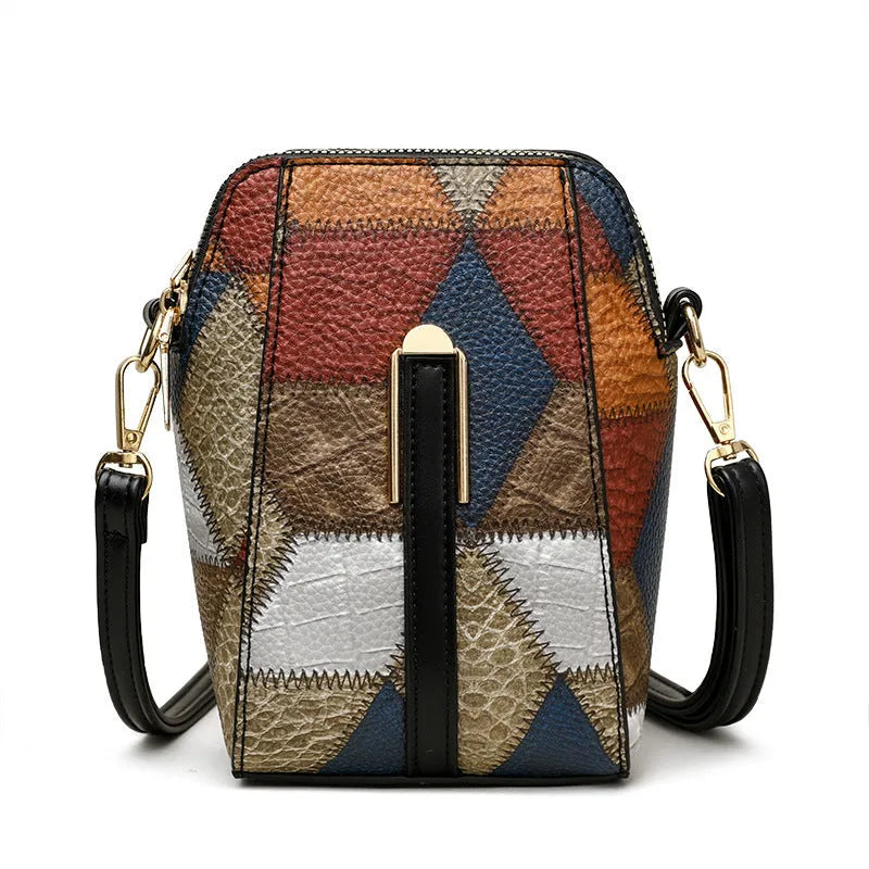 Soft PU shoulder bag with stitching detail, single strap, sandwich pocket, in irregular blue and black or blue and brown.