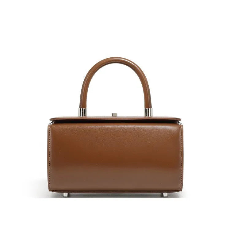 Structured leather women's crossbody bag in a clamshell design, shown in one of four colour options.