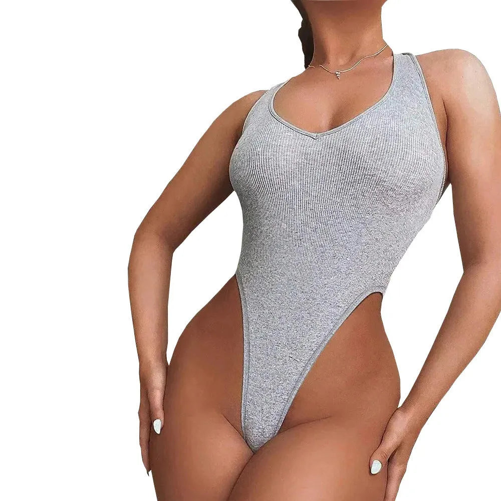 Grey viscose women's halter jumpsuit with suspenders and high-waisted shorts on a model.