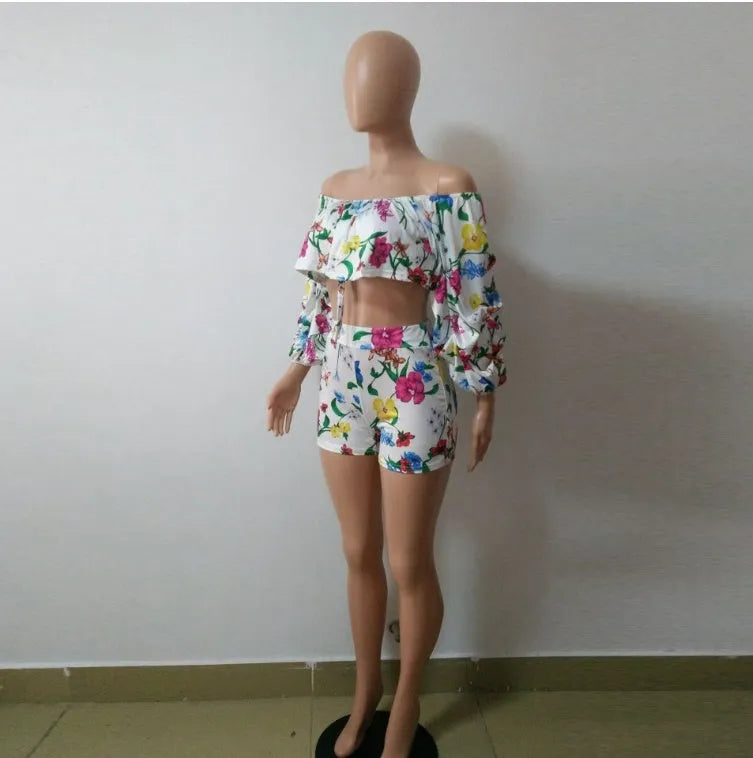 Multicolour digital print women's two-piece outfit with pile sleeve top and matching shorts.