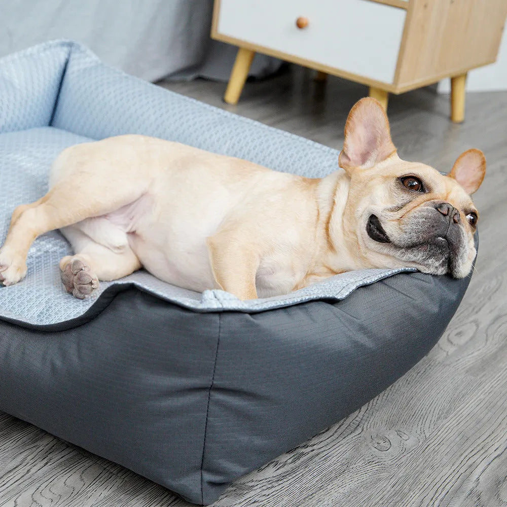 Soft grey dog bed with removable cover in small, medium, and large sizes.