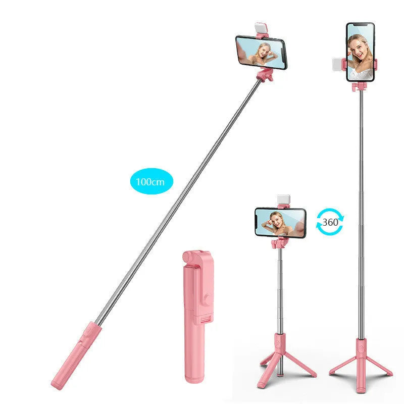 Black Bluetooth selfie stick with extended tripod legs holding a smartphone.