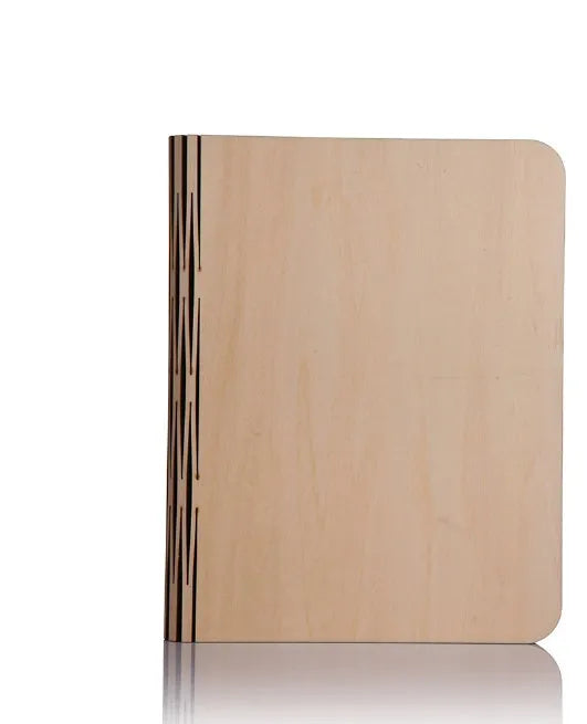 Solid wood book light with USB cable on a desk next to a book.