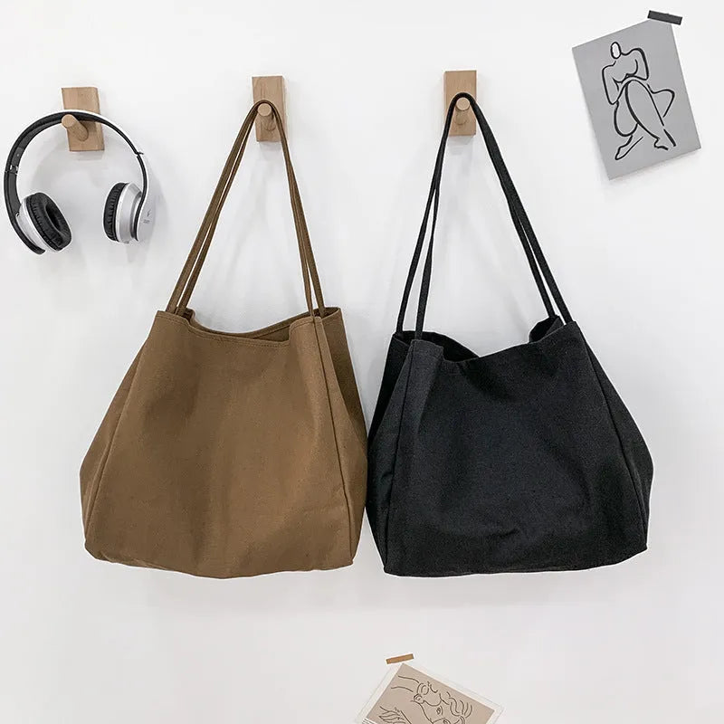 Women's solid colour canvas handbag with double shoulder straps and mobile phone pocket