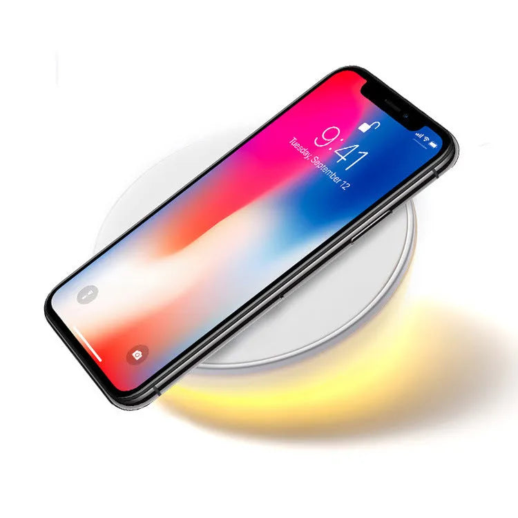 White smart wireless charger with digital clock display and three control buttons.
