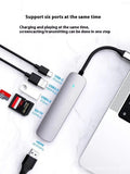 Silver aluminium USB-C 7-in-1 expansion dock with HDMI, VGA, USB 3.0 ports, and a 15cm cable