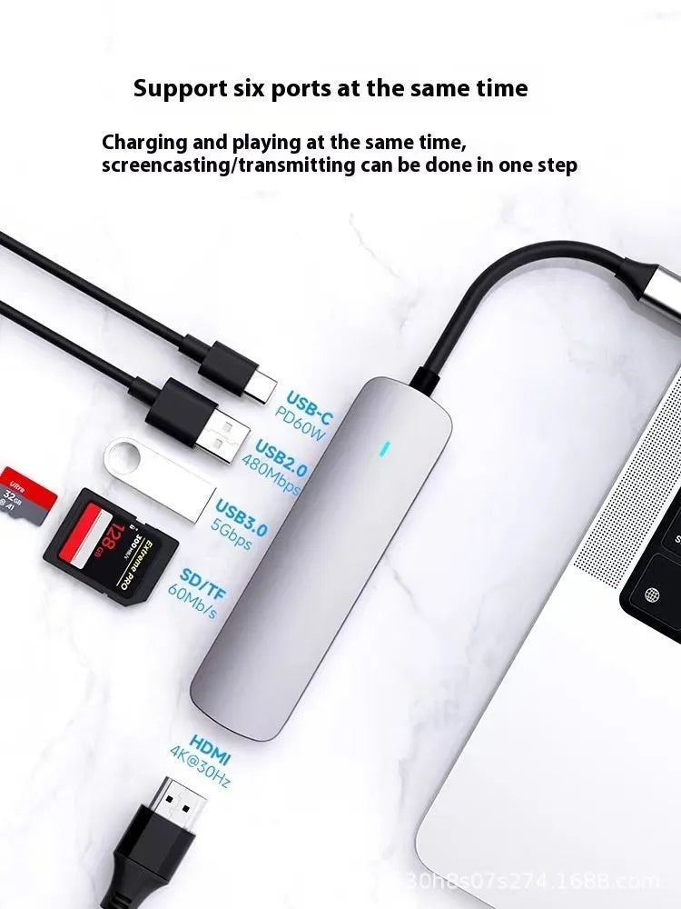 Silver aluminium USB-C 7-in-1 expansion dock with HDMI, VGA, USB 3.0 ports, and a 15cm cable