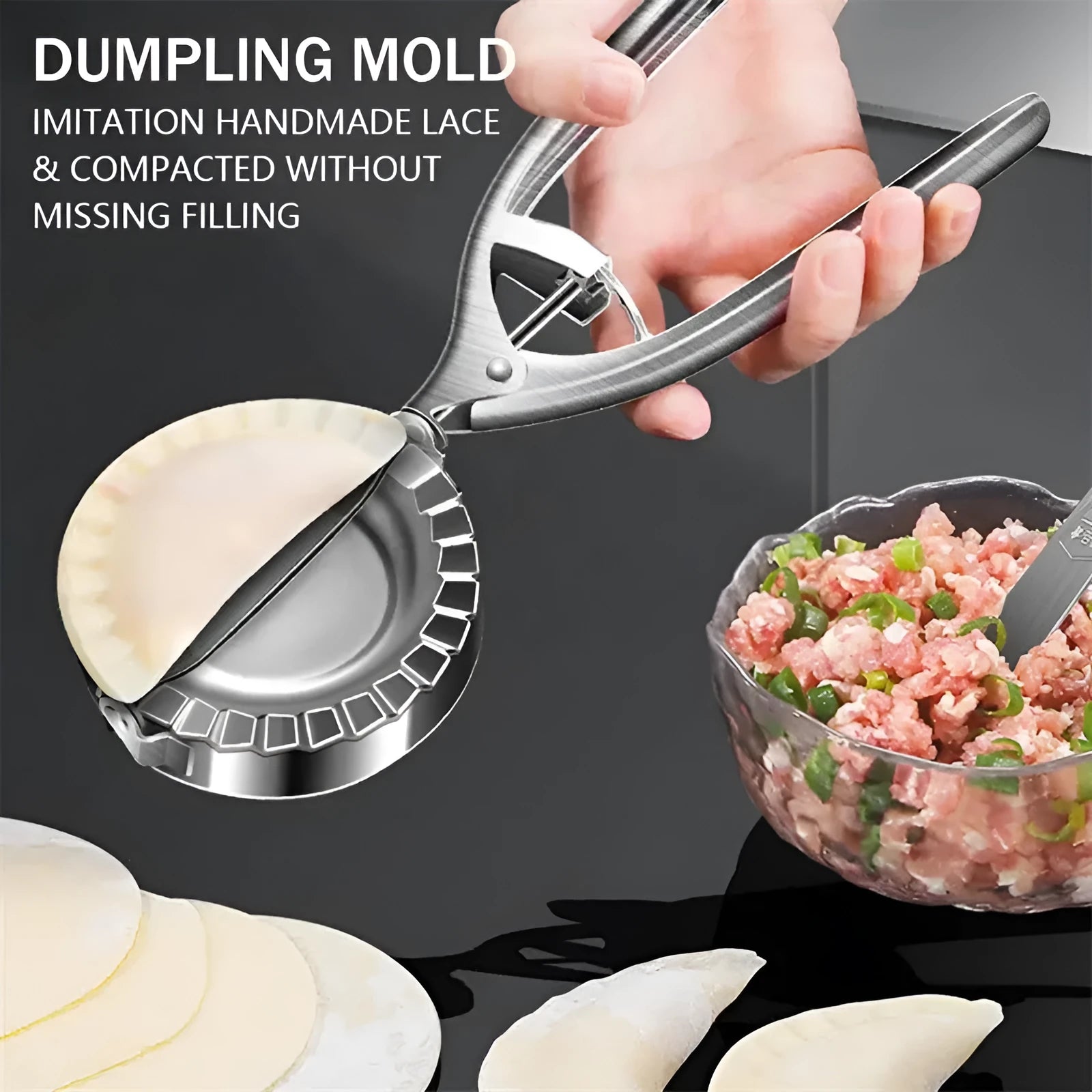 Silver stainless steel manual dumpling maker mould with handle for pressing and cutting wrappers.