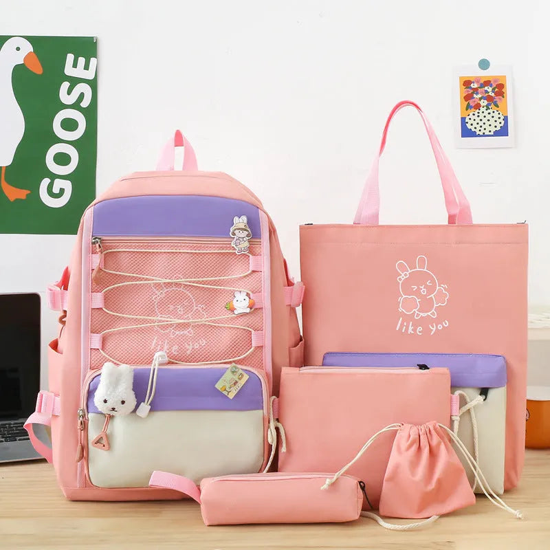 Nylon student backpack four-piece set in pink, black, purple, and blue with curved shoulder straps