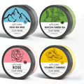 Four jars of clay facial masks: Dead Sea mud, green tea, turmeric, and rose clay in an 80ml 4-pack set.
