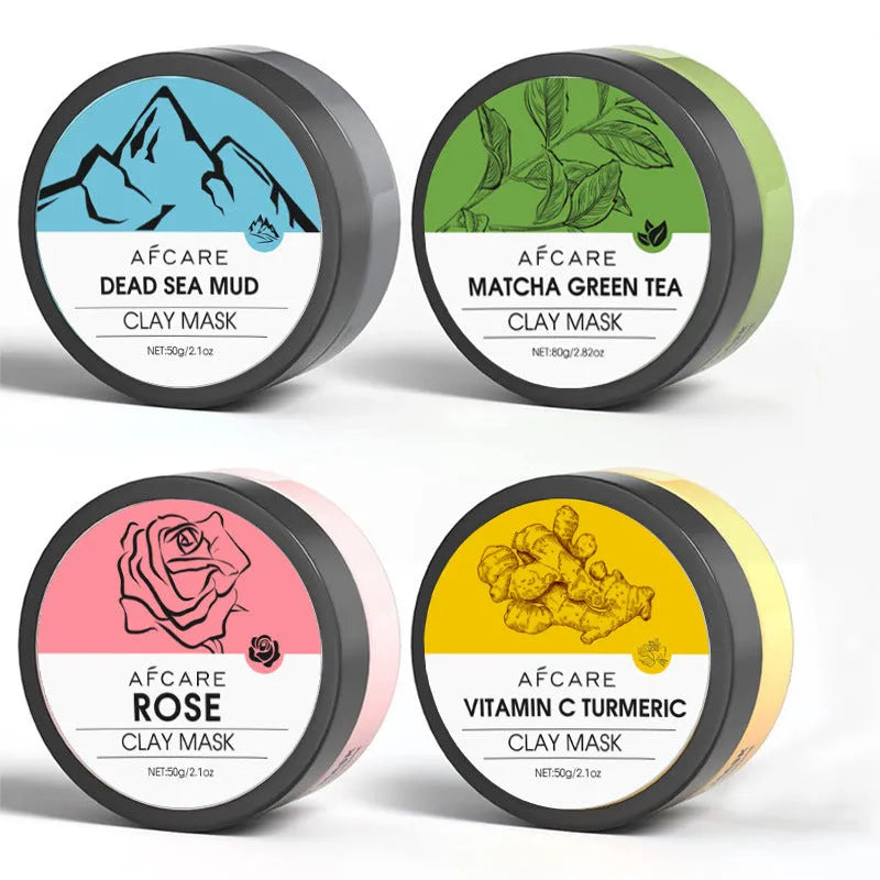 Four jars of clay facial masks: Dead Sea mud, green tea, turmeric, and rose clay in an 80ml 4-pack set.