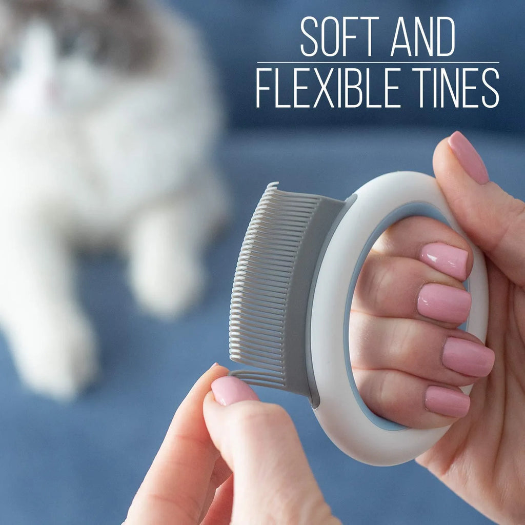 Blue pet grooming comb with ergonomic handle and soft teeth for cats and dogs on a white background.