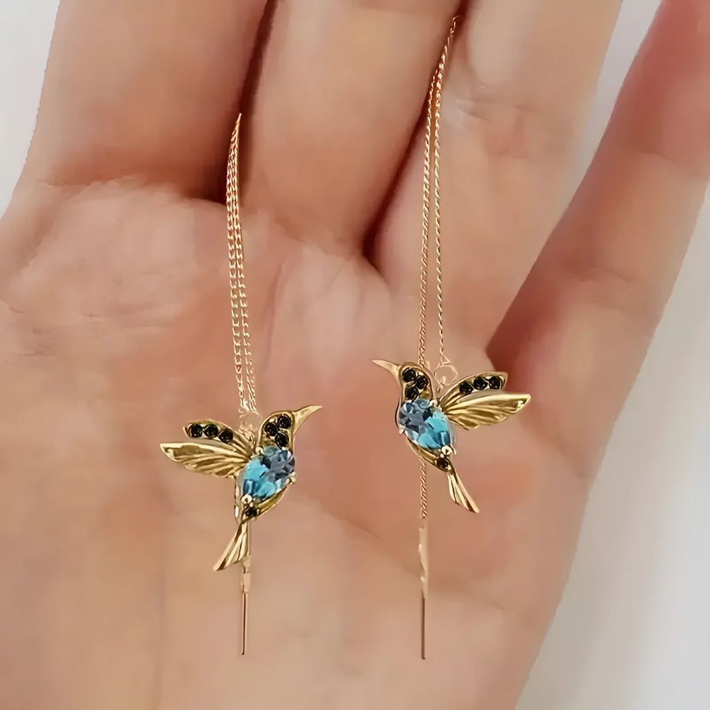 Long hanging bird earrings for women with alloy construction and mixed zirconium wings in red, blue, or red lvzuan.