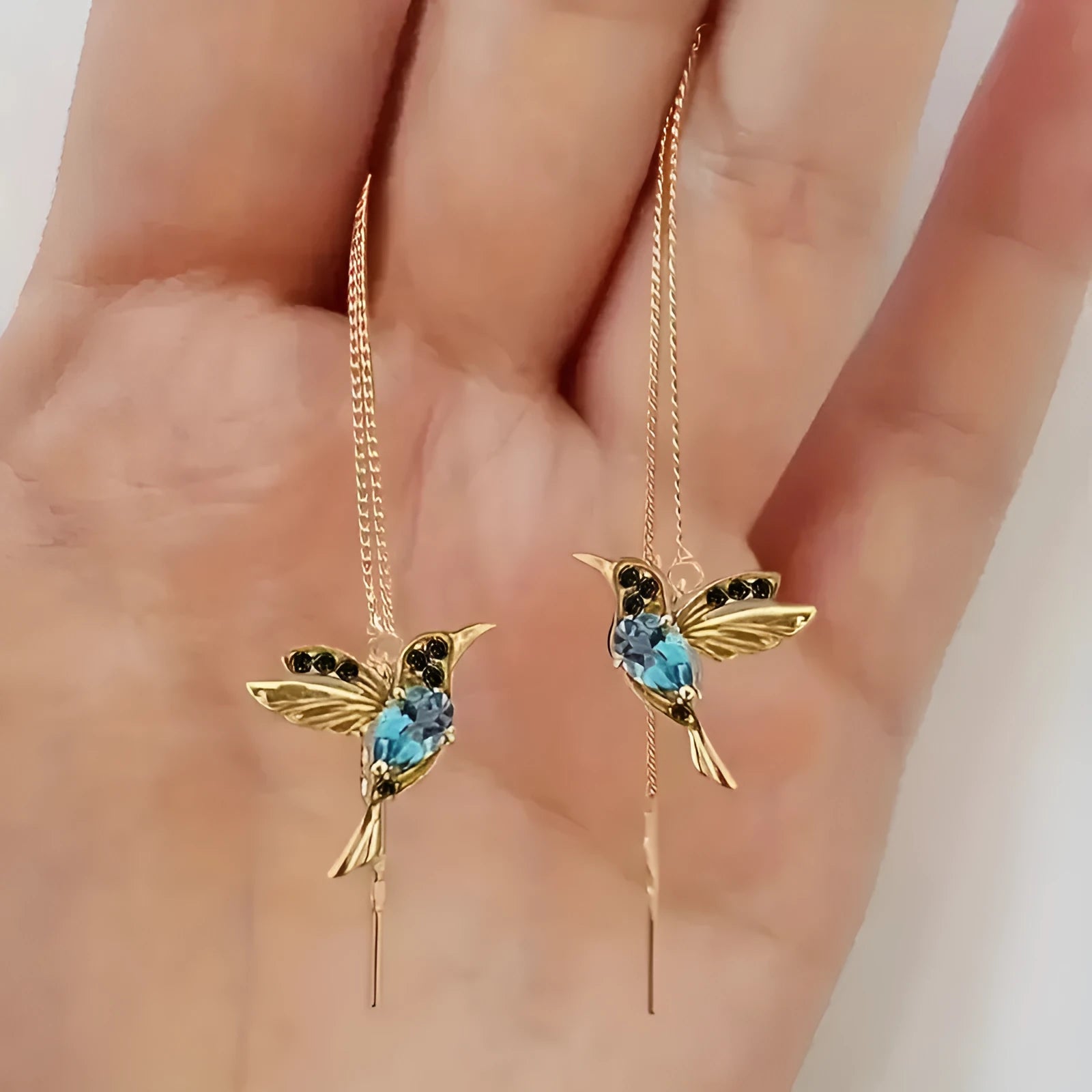 Long hanging bird earrings for women with alloy construction and mixed zirconium wings in red, blue, or red lvzuan.